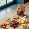 Life style photo of Elder's Remedy - elderberries, lemons and oranges jam with cookies by Beth's Farm Kitchen