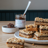 Open jar of fig jam and fig bars made by Beth's Farm Kitchen