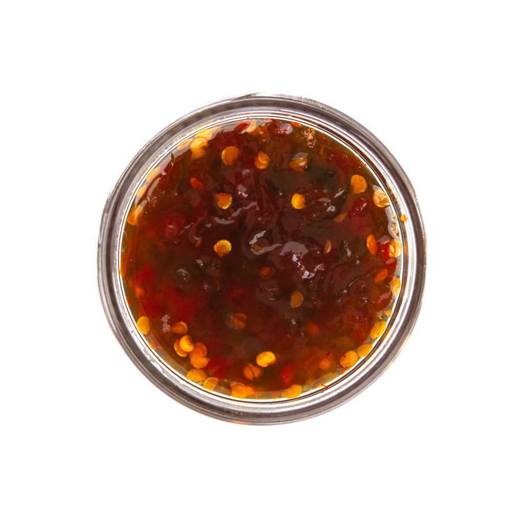 inside jar of mighty hot pepper jelly by Beth's Farm Kitchen